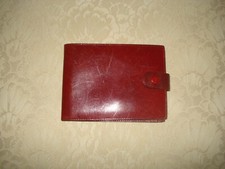 Portafoglio Rolex vintage pelle rossa bifold con logo corona oro e chiusura a scatto