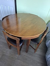 Mid-Century Round Dining Table with Concealed Chairs SpaceSaving Vintage Design