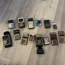14  Vintage calculator lot (TI/lloyd s/radios...
