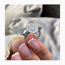 925 Sterling Silver Oval Cut Simulated Diamond Three-Stone Halo Engagement Ring