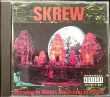 CD Skrew Burning In Water, Drowning In Flame Metal Blade Records