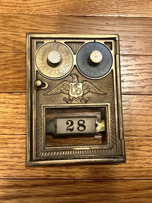 Post Office lock box door. U.S. with eagle and dual dial, combination.