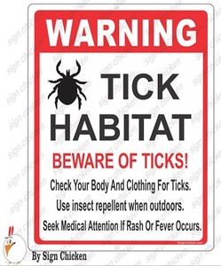 tick warning sign caution tick habitat ticks in area be careful tick habitat
