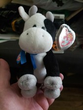 Ty Beanie Baby 2.0 Charlie the Cow plush toy featuring a blue bow tie