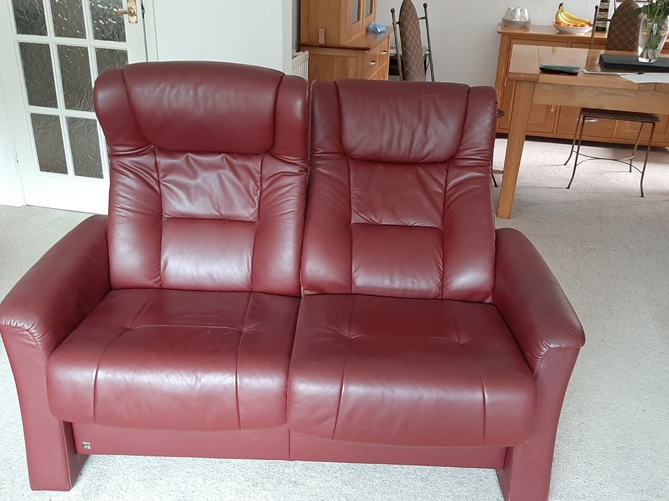 2 seater leather reclining sofa and armchair, with footstool. High