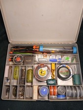 An Old Stewart Tackle Box Filled With Floats Hooks Weights Line Feeder And More.