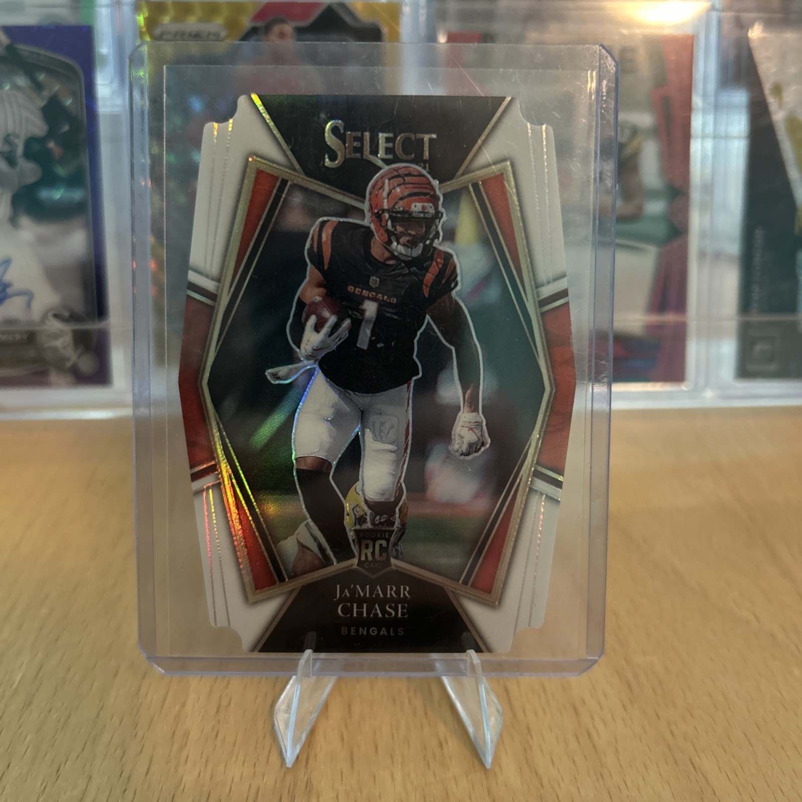 2021 Panini Select Premier Level Ja'Marr Chase #147 White Prizm Die-Cut /99 (RC)