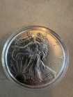 2016 $1 SILVER EAGLE = 1 OZ. .999 SILVER = U. S. MINT = UNCIRCULATED IN CAPSULE