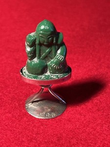 silver miniature small green Buda on pedestal
