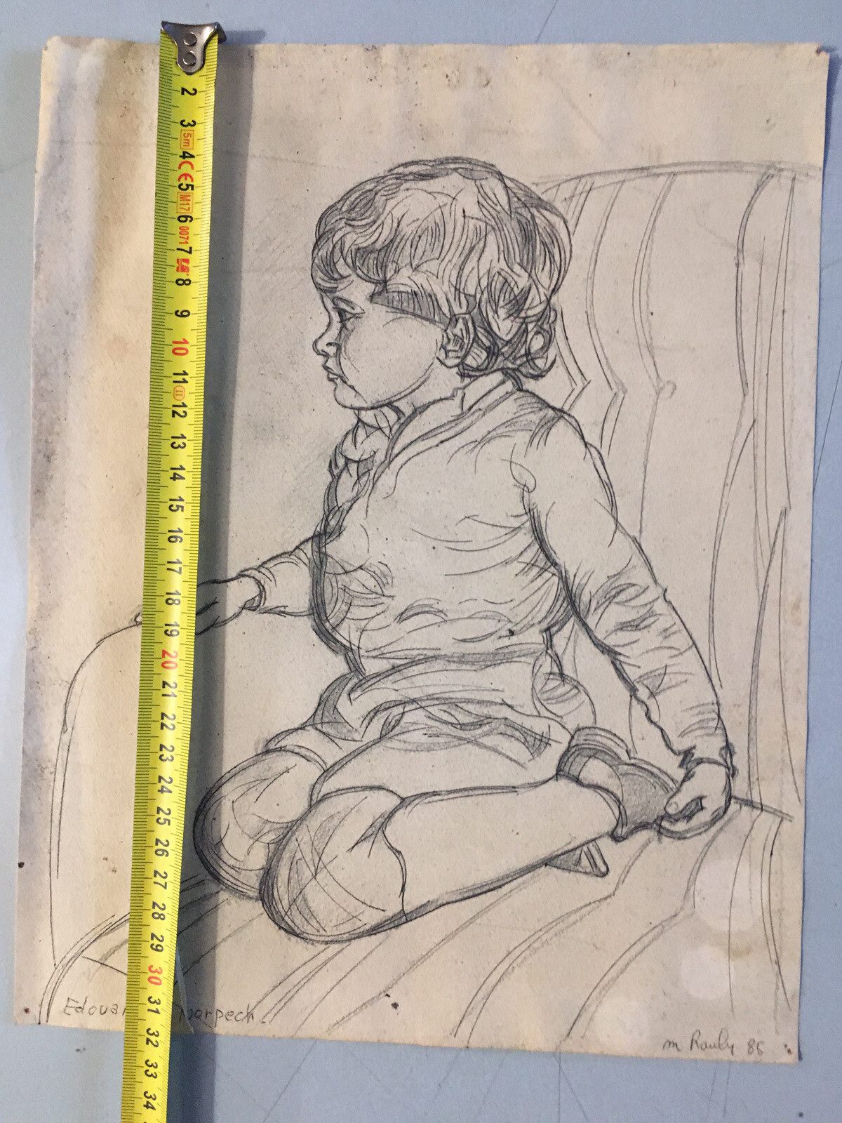 Beautiful drawing portrait child boy armchair on pencil paper Michel Rauly