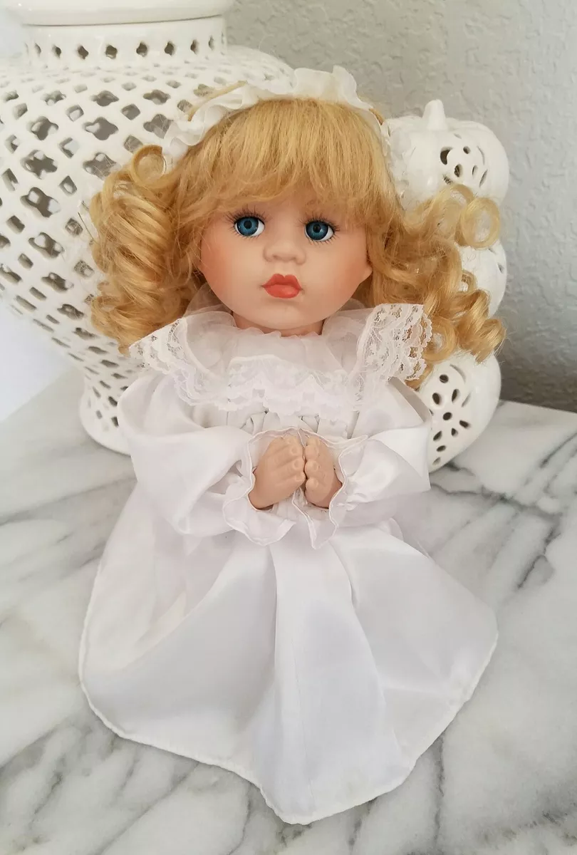 Praying hotsell porcelain doll