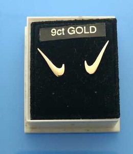nike gold studs