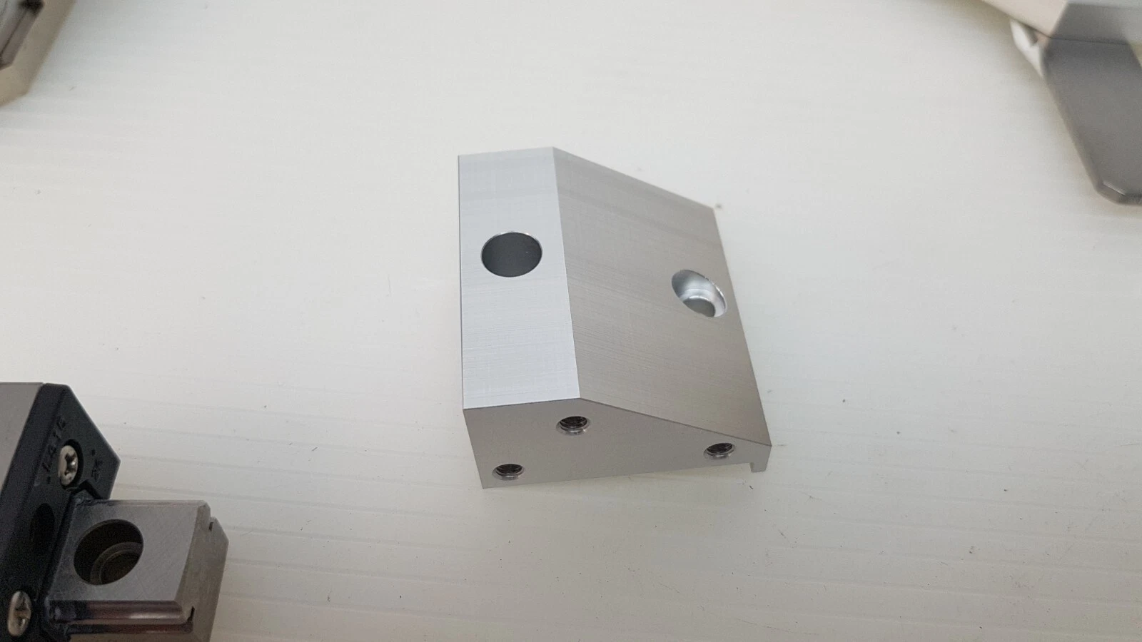 Angled aluminum mounting block with two through holes