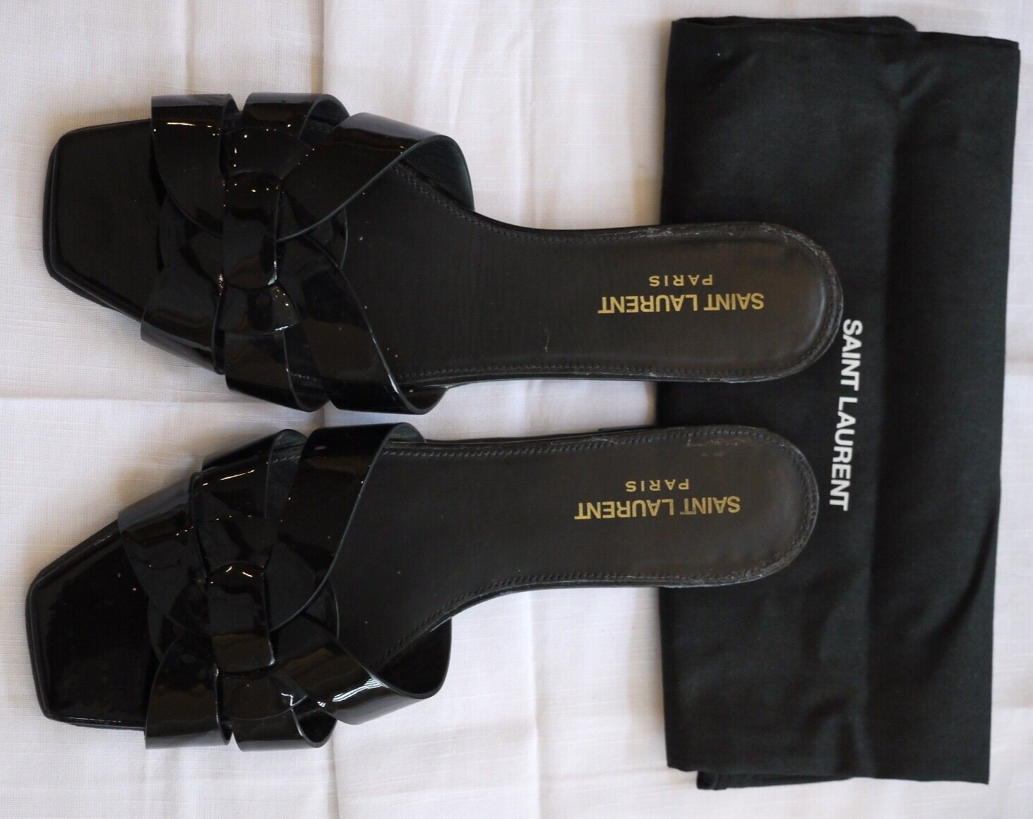 Diapositive brevetto tributo Saint Laurent