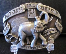 1988 Mid Kansas 20th Anniversary MCC Relief Sale Elephant Belt Buckle w/ Stand