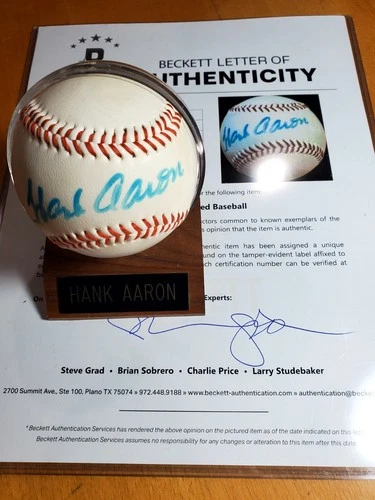 HANK AARON AUTOGRAPHED BASEBALL  (BECKETT COA WITH STEVE GRAD AUTOGRAPH)