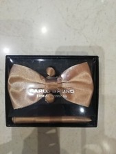 Gold bow tie with matching gold top pocket handkerchief