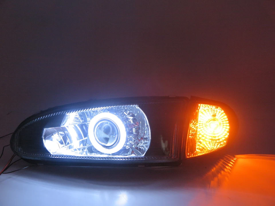 Faro HID biproyector CCFL de vidrio 2D Mirage 91-95 negro para Mitsubishi LHD Foto 3 de 4