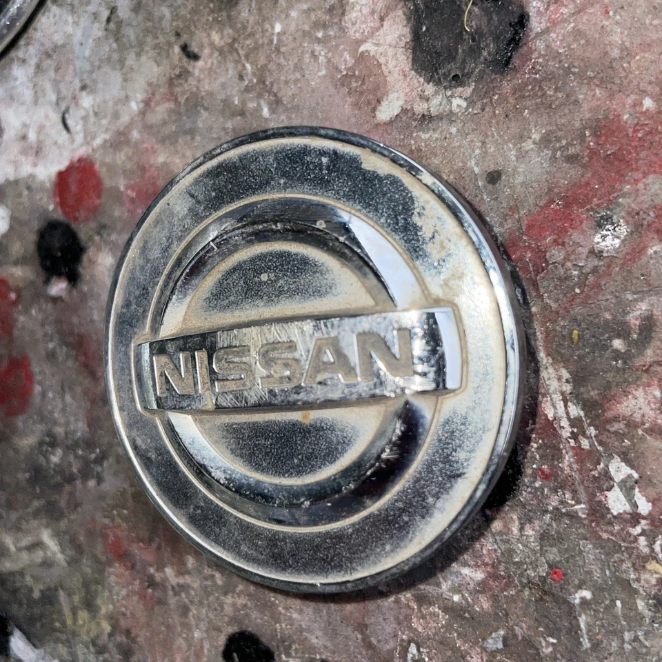 TAPA CENTRAL RUEDA NISSAN MURANO, QUEST, ROGUE, SENTRA, VERSA 40343-AU51A Foto 2 de 4