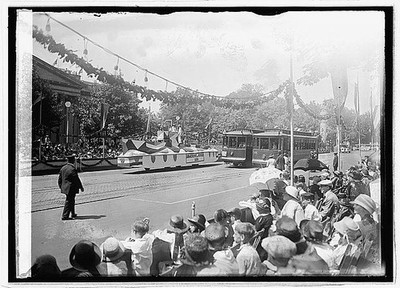 Photo:1923 Parade Float and Streetcar Crowd Scene