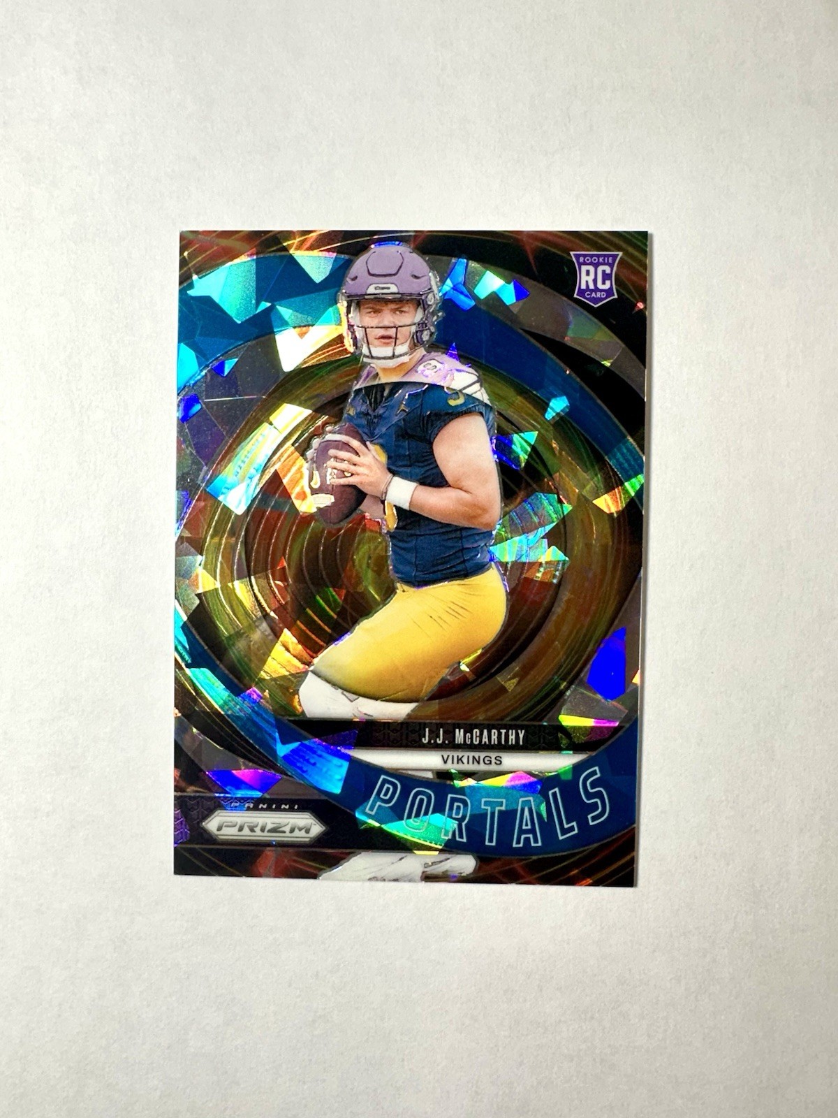 2024 Panini Prizm  J.J. McCarthy Portals Blue Cracked Ice Rookie Vikings RC /99