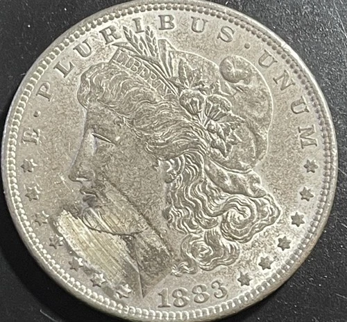 1883 $1 Morgan Silver Dollar. 90%. #1711. ( Has Rough Scrape on Obverse )