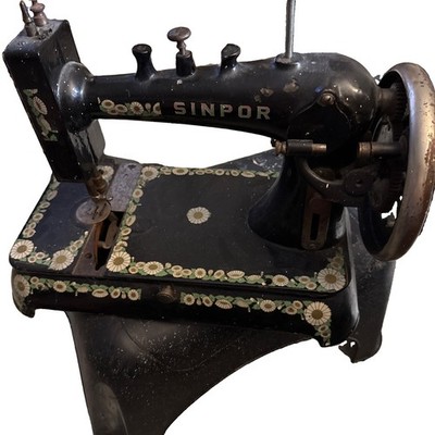 vintage Sinpor brand sewing machine from the early 20th century