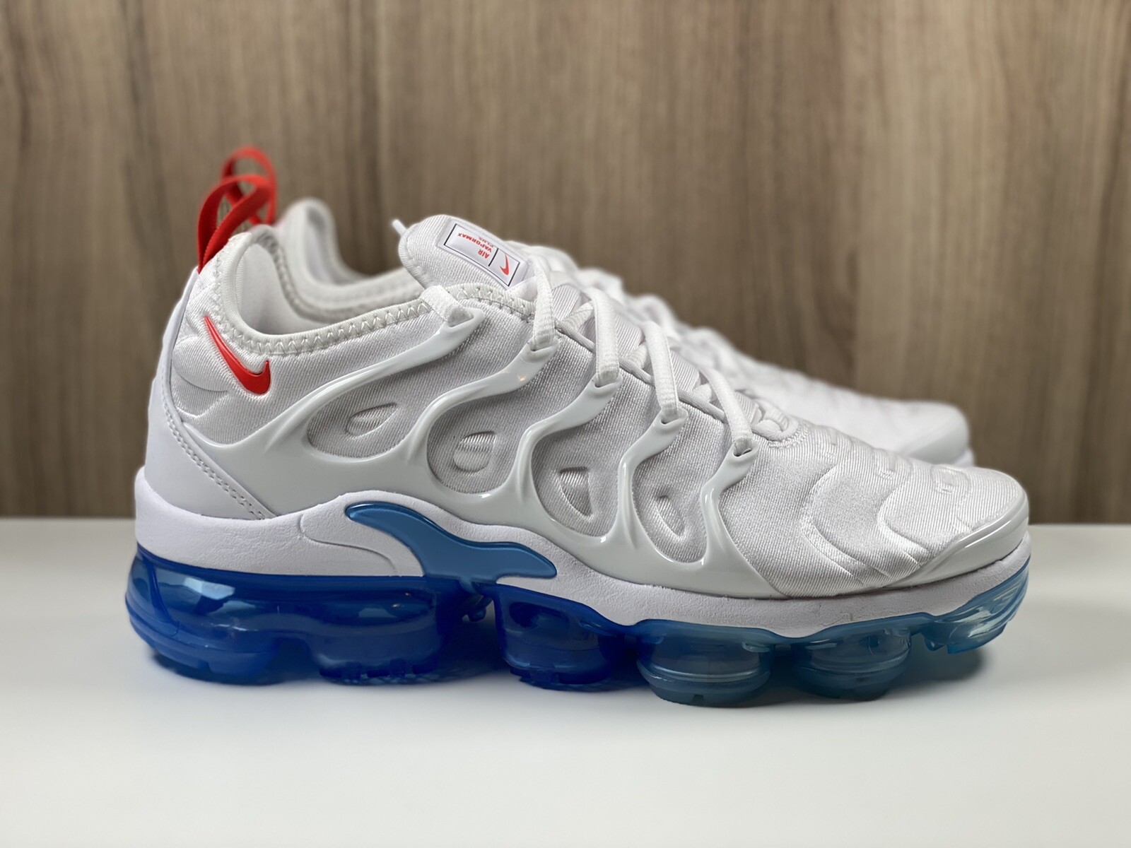 gray and white vapormax plus