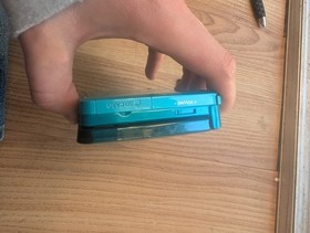 3DS aqua Blue. No Charger. Plastic Screen Protectors Still Intact. Read Descript
