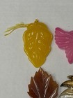 Lot Of 4 Vintage-style translucent plastic leaf and butterfly pendants/jewelry — photo 2