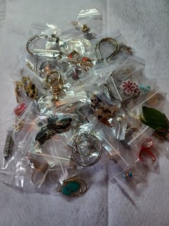 Huge lot of pierced earrings 100 in total. Many styles shapes sizes & colors.