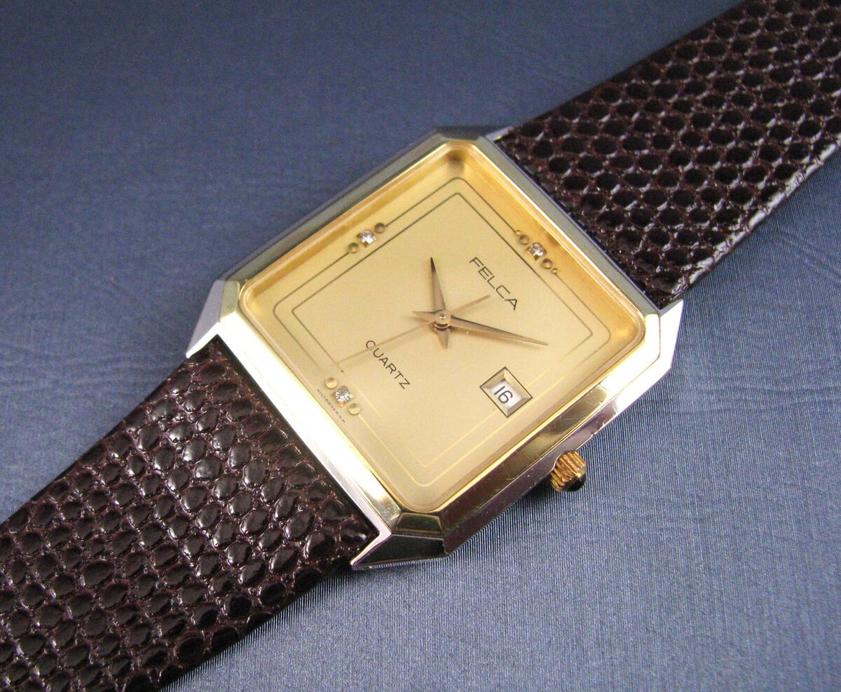 Vintage Felca Swiss Stainless Steel and Gold Tone Quartz Vintage Felca Swiss Stainless Steel and Gold Tone Quartz