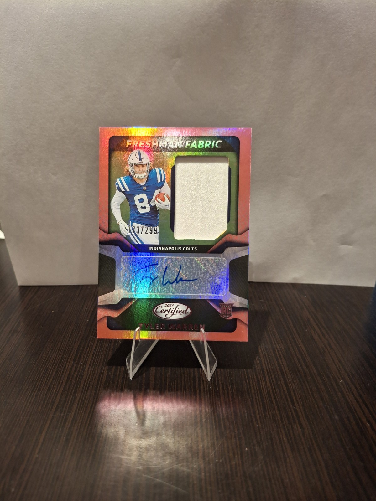 2025 Panini Certified Freshman Fabric Tyler Warren Orange Rookie Patch Auto /249