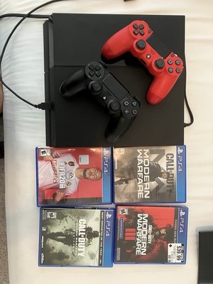 Sony PlayStation 4 500gb Jet Black Console With Two Controllers and 4 Games