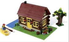LEGO CREATOR (5766) Cabaña de troncos 100% completa con minifigura