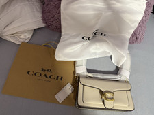Coach Schultertasche Leder Creme gold Drehver...