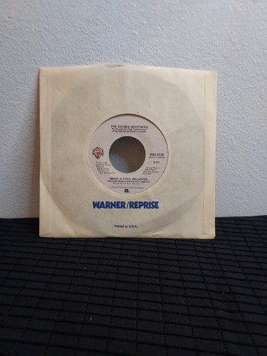 The Doobie Brothers~What A Fool Believes & Don'T Stop To Watch The Wheels 7" LP - Picture 1 of 4