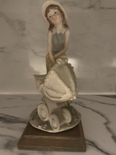 Vintage Capodimonte Figurine , Girl Pushing A Pram , Artist Auro Belcari .