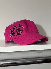 pink baseball cap with apple design
