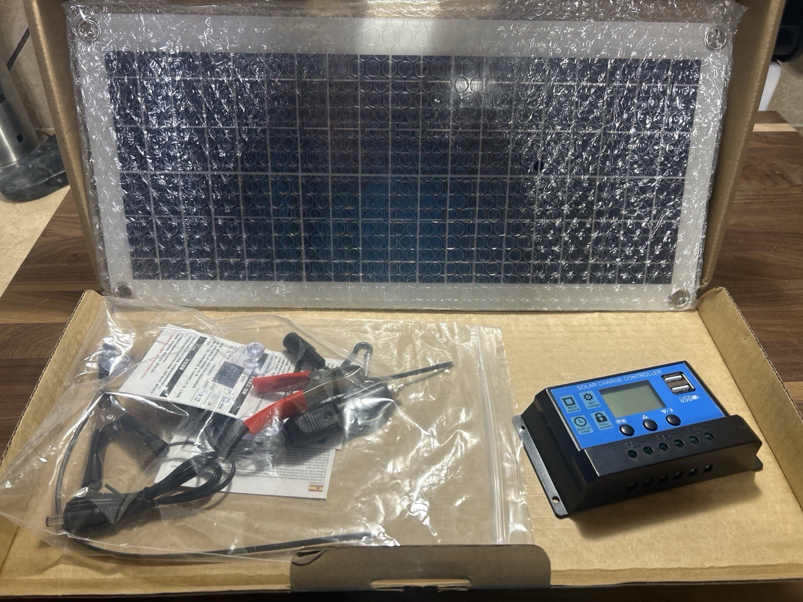 BRAND NEW, NEVER USED small solar panel charging kit. Charge