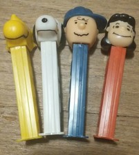 Vintage Pez Dispenser lot of 4 - SNOOPY - PEANUTS Charlie Brown Lucy Woodstock