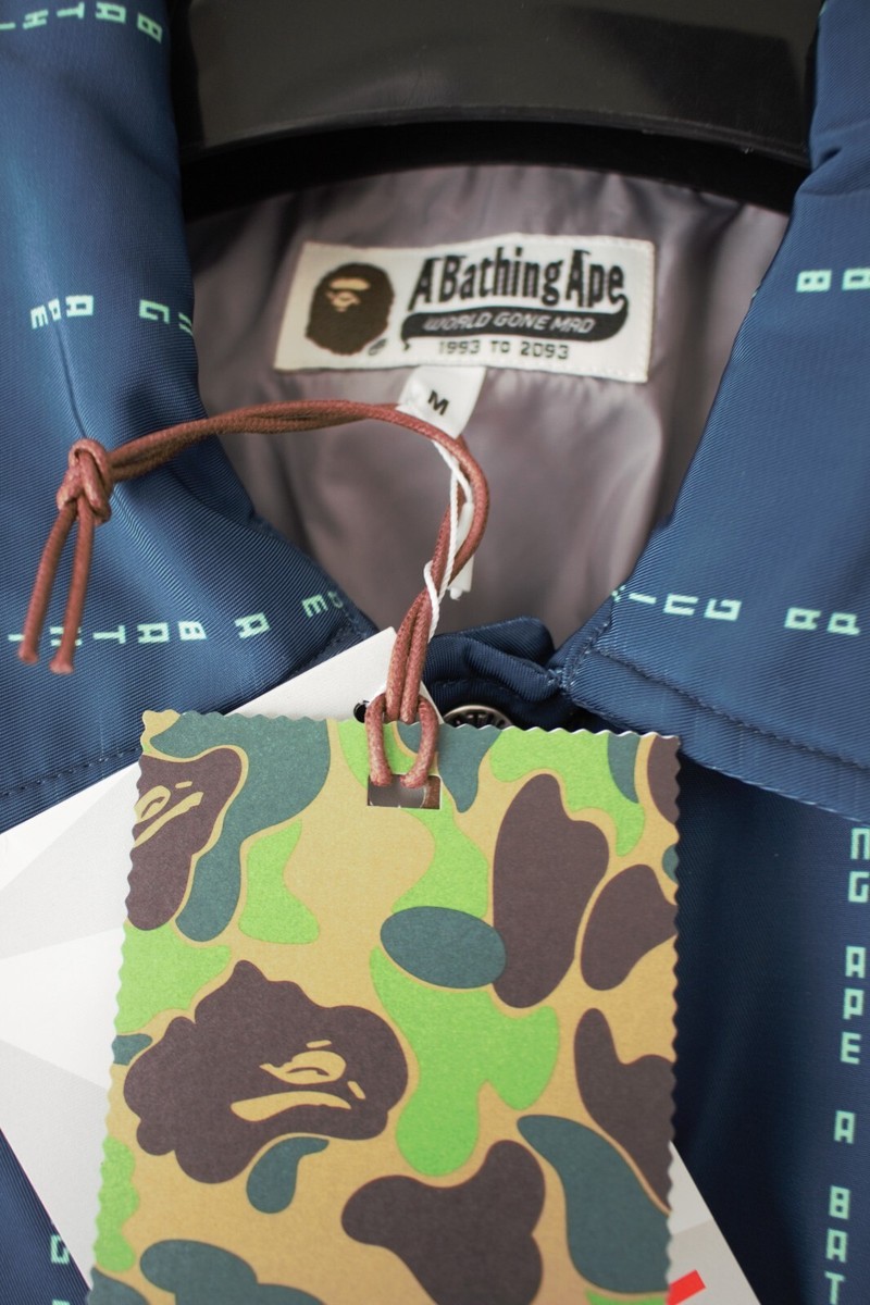 A BATHING APE BAPE TEXT STRIPE RELAXED COACH JACKET A BATHING APE BAPE TEXT STRIPE RELAXED COACH JACKET