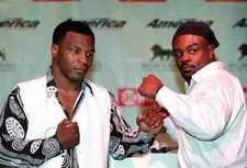 Mike Tyson poses with Orlin Norris at a press conference before th- Old Photo