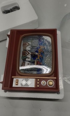 RAZ Imports 4200757 Santa Flying Over Town Musical Lighted Water TV Figurine