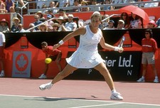 Monica Seles of Yugoslavia hits a return at a women's singles matc- Old Photo 28