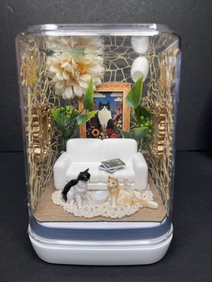 Gold jumping spider enclosure with cats and cat painting 