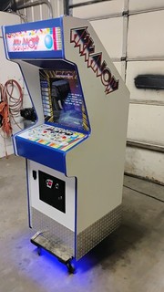 Arkanoid arcade cabinet running Revenge of Doh PCB