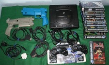 Sega Saturn Bundle: Console, controllers, light guns, House of the Dead + more