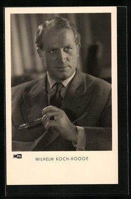 AK actor Wilhelm Koch-Hooge in a suit with glasses in his hand