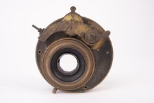 Vintage brass lens with shutter. Works properly.